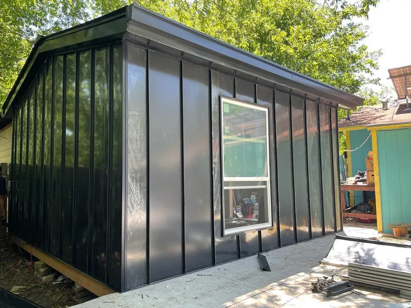 Black standing seam metal wall panels for Roof Inspection in Dexter