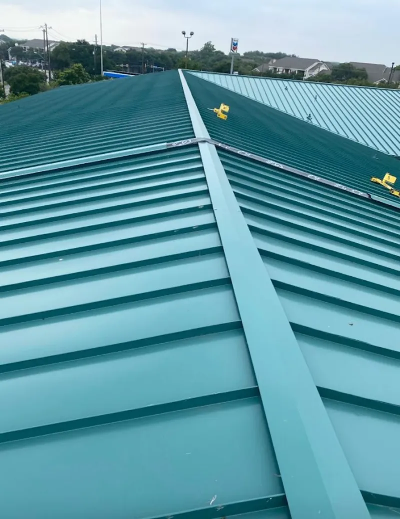 Green commercial metal roof ridge and valley for Metal Roof Repair in Dexter