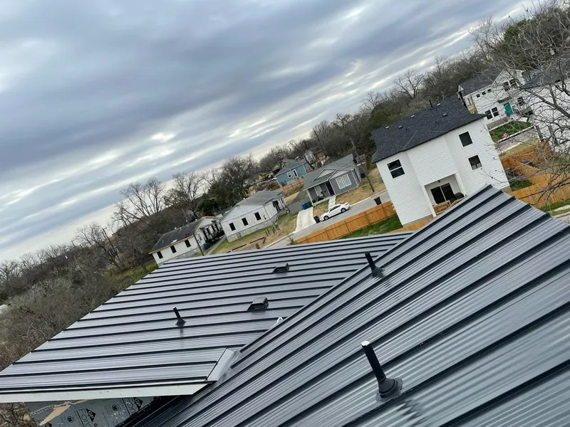 Standing seam metal roof panels with vents for Skylight Repair in Dexter